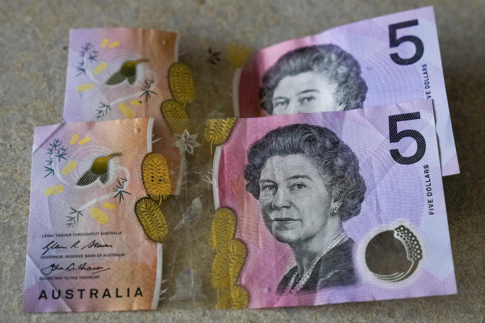 Australian $5 notes are pictured in Sydney, Septembe 10, 2022. King Charles III won't feature on Australia's new $5 bill, the nation's central bank has announced, signaling a phasing out of the British monarchy from Australian banknotes, although he is still expected to feature on coins. / Credit: Mark Baker/AP