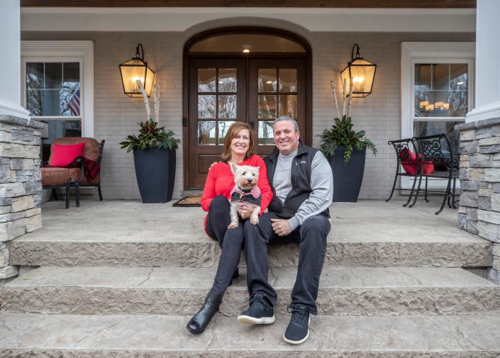 Mike and Renee Major, and their dog, "Cupcake"  on the steps of their home northeast of Louisville.  January 14, 2022