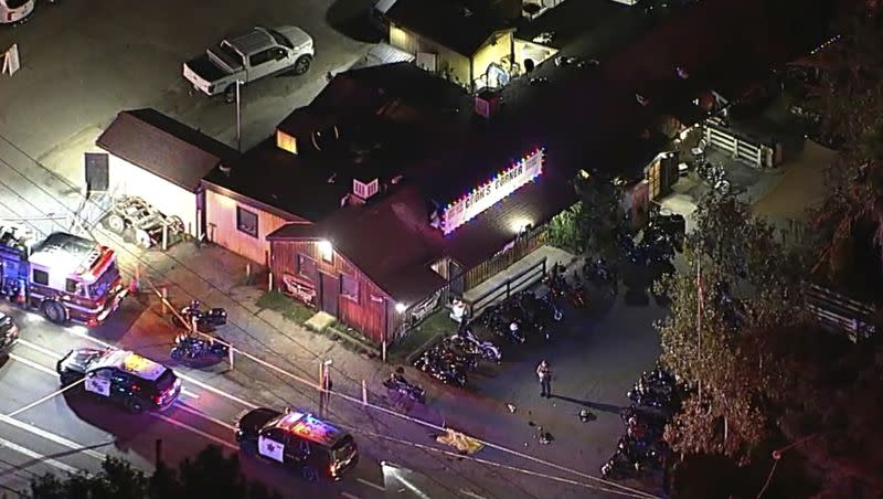 In an image from video, authorities work at the scene of a fatal shooting Wednesday, Aug. 23, 2023, at Cook’s Corner, a biker bar in rural Trabuco Canyon, Calif., in Orange County. 