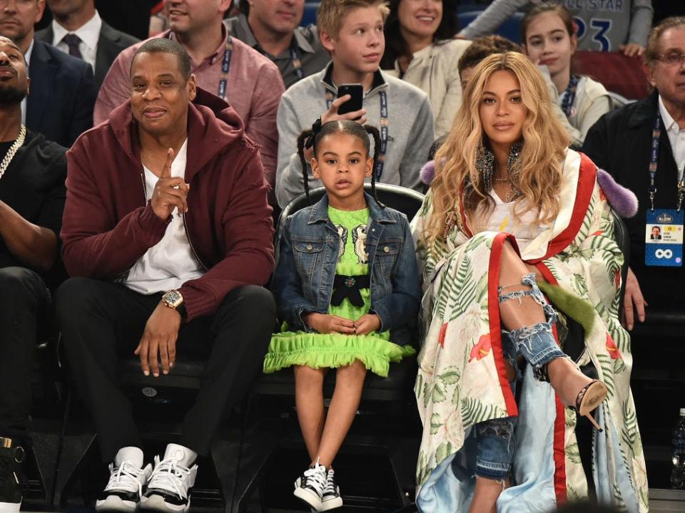 The Carter family sitting courtside at the 2017 NBA All-Star game.