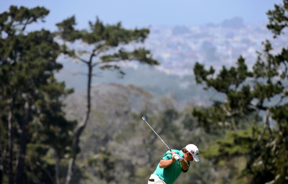 SAN FRANCISCO, CA - JUNE 14: Graeme McDowell of Northern Ireland hits a shot on the first hole during the first round of the 112th U.S. Open at The Olympic Club on June 14, 2012 in San Francisco, California. (Photo by Harry How/Getty Images)