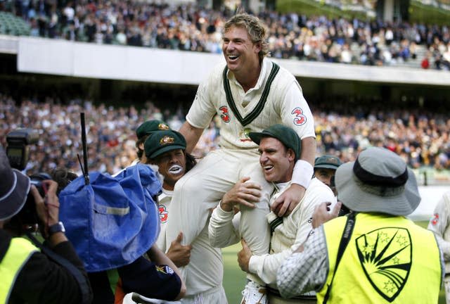 Australia’s man-of-the-match Shane Warne is carried from the field by team-mates Andrew Symonds and Matthew Hayden after victory on the third day of the fourth Test match against England at the MCG in Melbourne 