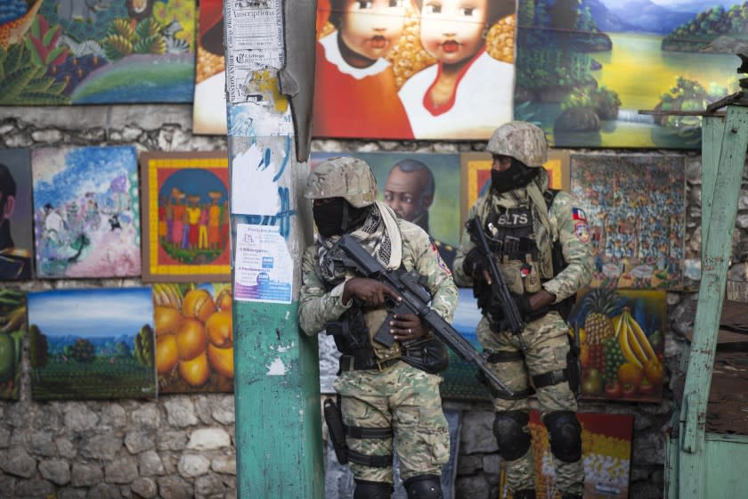 Soldiers patrol in Petion Ville, the neighborhood where the late Haitian President Jovenel Moise lived in Port-au-Prince, Haiti, Wednesday, July 7, 2021. Moïse was assassinated in an attack on his private residence early Wednesday, and first lady Martine Moïse was shot in the overnight attack and hospitalized, according to a statement from the country's interim prime minister. (AP Photo/Joseph Odelyn)