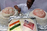 Iniyan, 49, gives final touches to a idili, savoury rice cake, decorated in the shapes of US President Donald Trump and Indian Prime Minister Narendra Modi in Chennai on February 24, 2020, on the occasion of Trump's visit to India. (Photo by Arun SANKAR / AFP) (Photo by ARUN SANKAR/AFP via Getty Images)