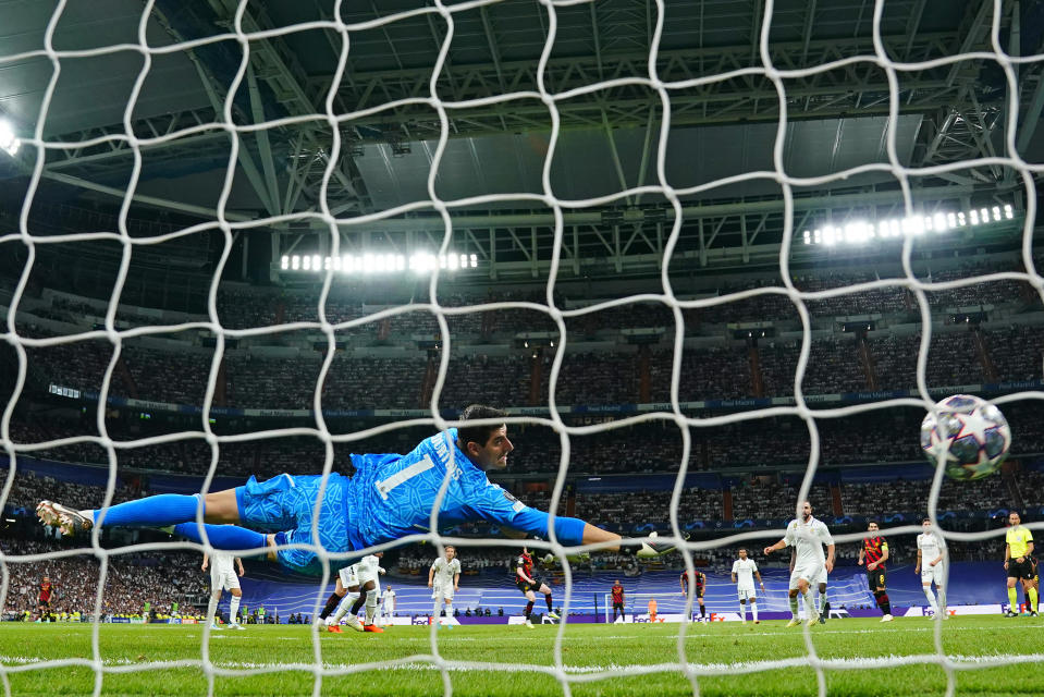 Real Madrid's goalkeeper Thibaut Courtois is beaten by a shot from Manchester City's Kevin De Bruyne who scored his side's first goal during the Champions League semifinal first leg soccer match between Real Madrid and Manchester City at the Santiago Bernabeu stadium in Madrid, Spain, Tuesday, May 9, 2023. (AP Photo/Manu Fernandez)