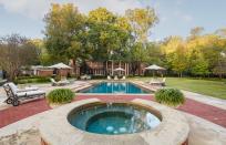 <p>The home’s picturesque backyard and pool, perfect for entertaining. Yours for $12.95 million. (Allie Beth Allman & Associates) </p>