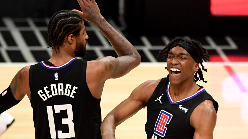 Reggie Jackson, right, reacts with teammate Paul George #13 of the LA Clippers after scoring and drawing the foul against the Utah Jazz. (Photo by Keith Birmingham/MediaNews Group/Pasadena Star-News via Getty Images)