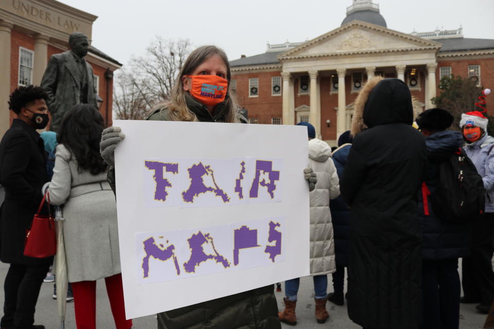 FILE - Amanda SubbaRao holds a sign calling for "Fair Maps" during a rally in Annapolis, Md., on Dec. 8, 2021. Maryland lawmakers who produced the first congressional map drawn by Democrats to be struck down this redistricting cycle will vote on a new map this week, a spokesman for a legislative leader said Monday, March 28, 2022. (AP Photo/Brian Witte, file)