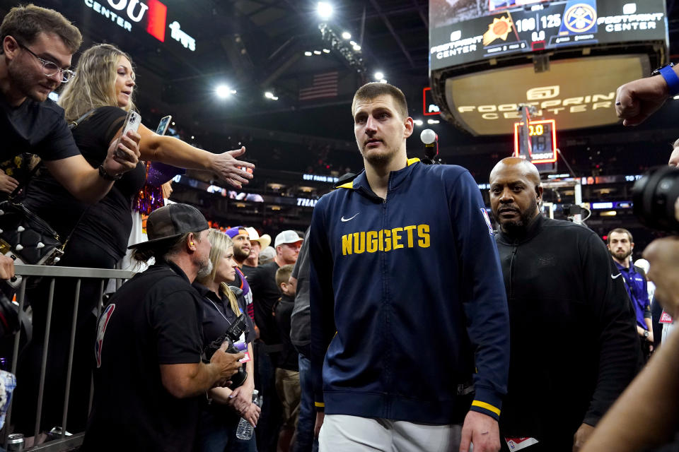 Denver Nuggets center Nikola Jokic leaves the court after Game 6 of an NBA basketball Western Conference semifinal game against the Phoenix Suns, Thursday, May 11, 2023, in Phoenix. The Nuggets eliminated the Sun in their 125-100 win. (AP Photo/Matt York)
