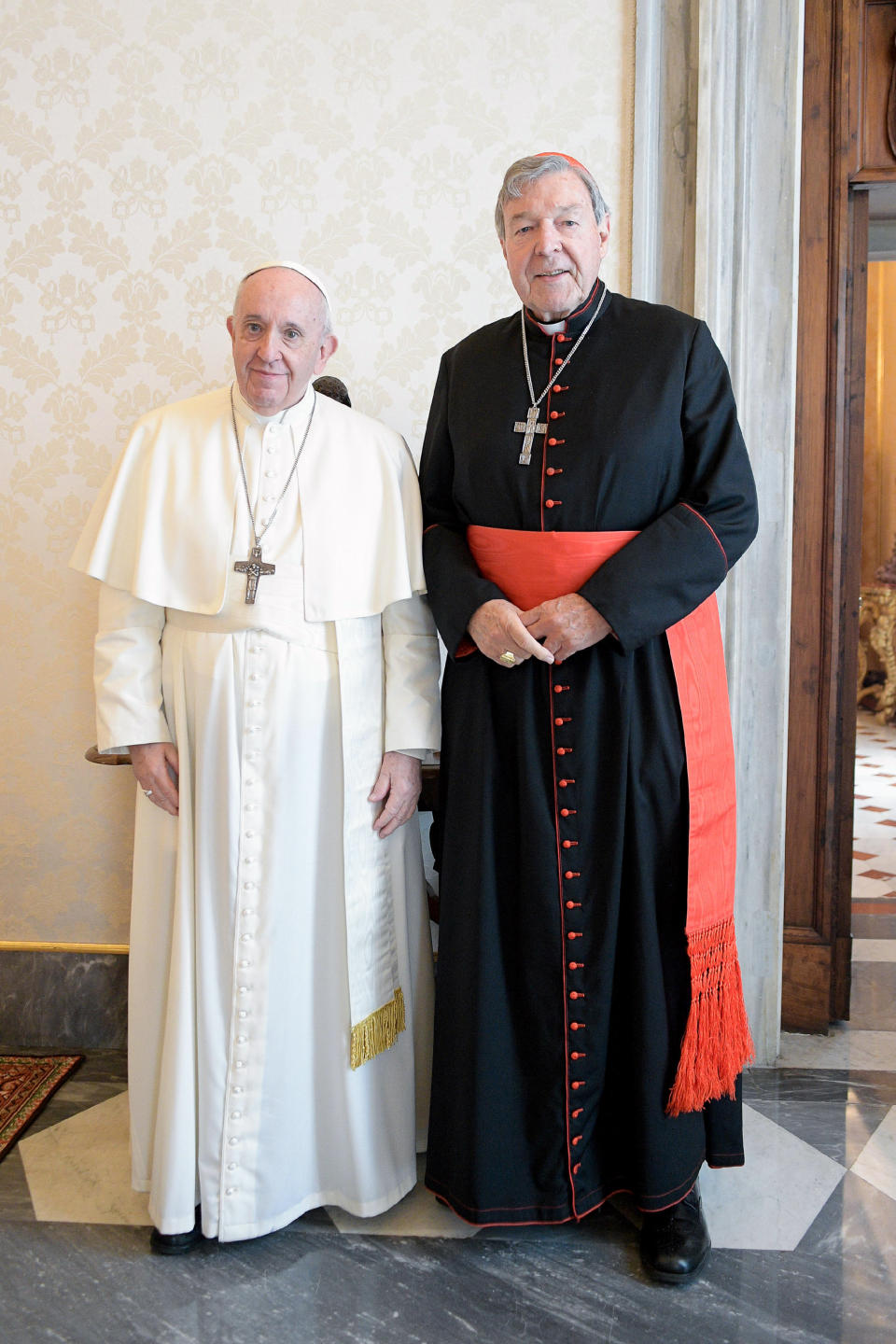 Pope Francis, left, stands next to Cardinal George Pell on the occasion of their private meeting at the Vatican, Monday, Oct. 12, 2020. The Pope warmly welcomed Cardinal for a private audience in the Apostolic Palace after the cardinal’s sex abuse conviction and acquittal in Australia. (Vatican News via AP)