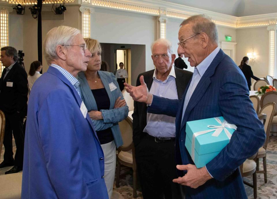 Howard Cox, Lynn Connelly and Kenneth Himmel chat with guest speaker Stephen Ross, founder of Related Group, following the Palm Beach Civic Association's Signature Speaker Series Luncheon Monday at The Beach Club.