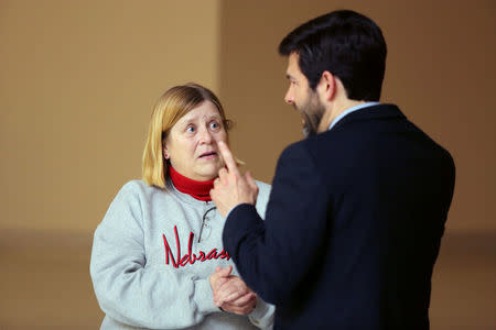 Bonny Kilmurry talks with Nebraska Human Trafficking Task Force coordinator Glen Parks at a seminar in O'Neill, Nebraska, U.S. April 12, 2017. REUTERS/Lane Hickenbottom