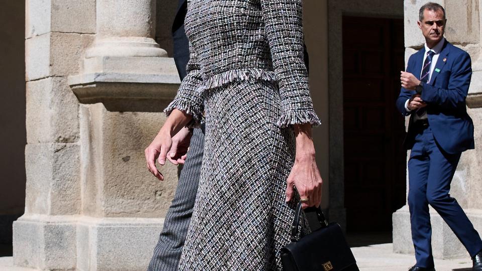 Queen Letizia of Spain wears a tweed dress while in Spain