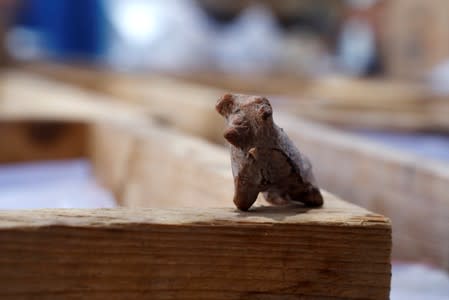 A figurine, part of findings uncovered at a huge prehistoric settlement discovered by Israeli archaeologists, is seen at the excavation site in the town of Motza near Jerusalem