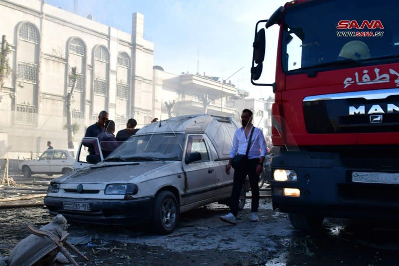 Emergency and security personnel inspect the rubble at the site of strikes that hit a building annexed to the Iranian embassy in Syria's capital Damascus on Monday. Hezbollah accused Israel of carrying out the attack, but Israel had not commented Monday afternoon.

Photo by Syrian Arab News Agency/UPI