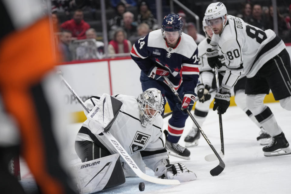 Los Angeles Kings goaltender Cam Talbot (39) deflects a puck during the first period of an NHL hockey game against the Washington Capitals in Washington, Sunday, Jan. 7, 2024. (AP Photo/Manuel Balce Ceneta)