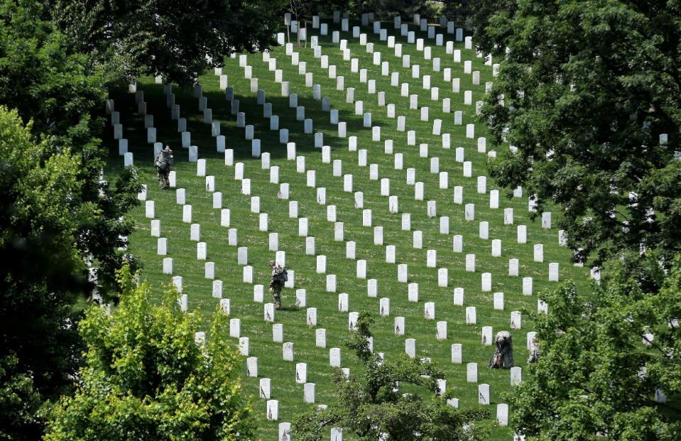 <p>Soldiers of the 3rd U.S. Infantry Regiment (The Old Guard) place flags in front of the graves at Arlington National Cemetery in Washington, U.S., May 26, 2016. (Joshua Roberts/REUTERS) </p>