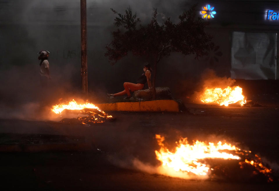 Supporters of opposition leader, Santa Cruz Gov. Luis Fernando Camacho who faces terrorism charges, protest his arrest, blocking a road in Santa Cruz, Bolivia, Jan. 3, 2023. (AP Photo/Juan Karita)