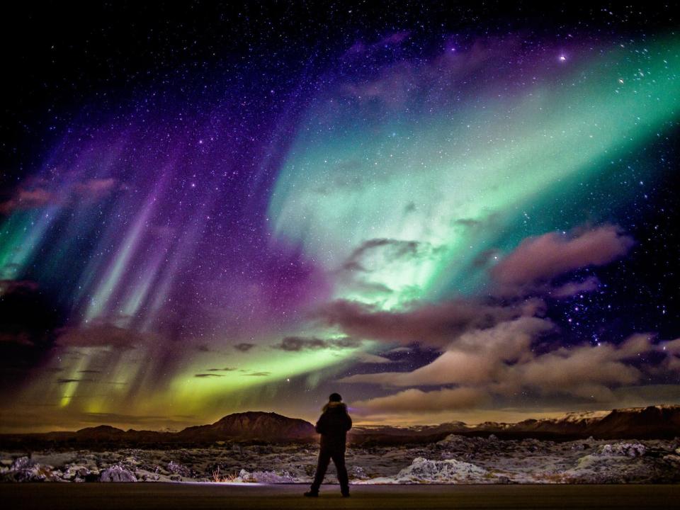 Aurora borealis, aka the Northern lights, as seen over a lava landscape located in Reykjanes Peninsula, Iceland.