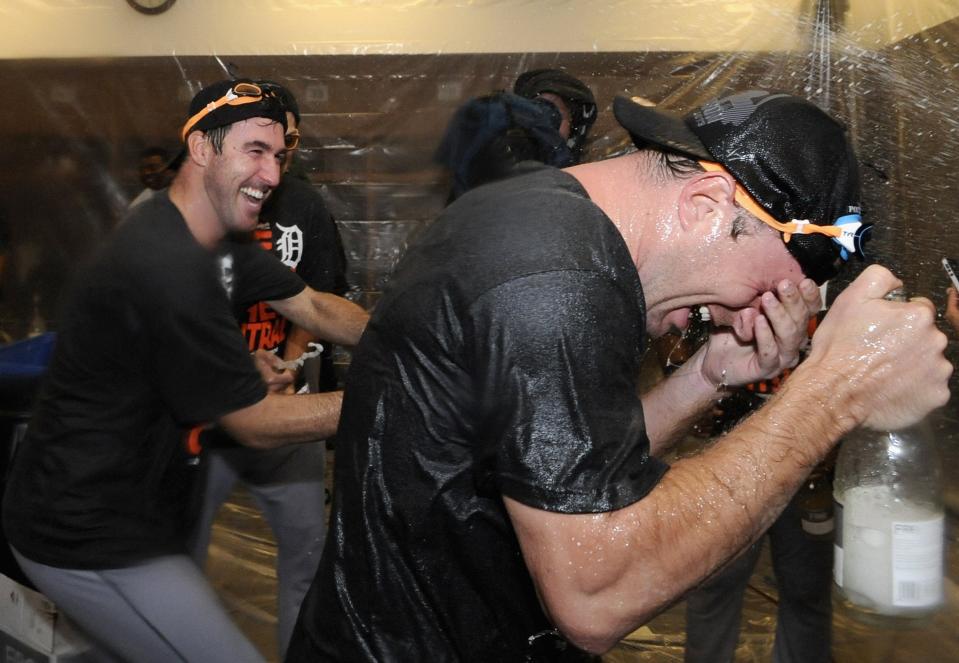 Tigers pitchers Justin Verlander and Max Scherzer celebrate with champagne in the clubhouse after the Tigers defeated the Twins, 1-0, on Sept. 25, 2013, in Minneapolis, to clinch the American League Central Division title.