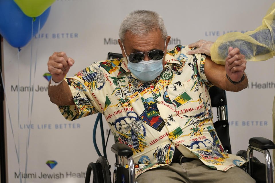 Eulalio Gonzalez, 82, reacts after getting the Moderna COVID-19 vaccine at Miami Jewish Health, a senior healthcare facility, Monday, Dec. 28, 2020, in Miami. (AP Photo/Lynne Sladky)