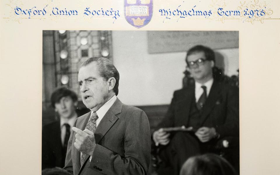 Philip May (left) behind Richard Nixon, speaking at the Oxford Union - Credit: Geoff Pugh