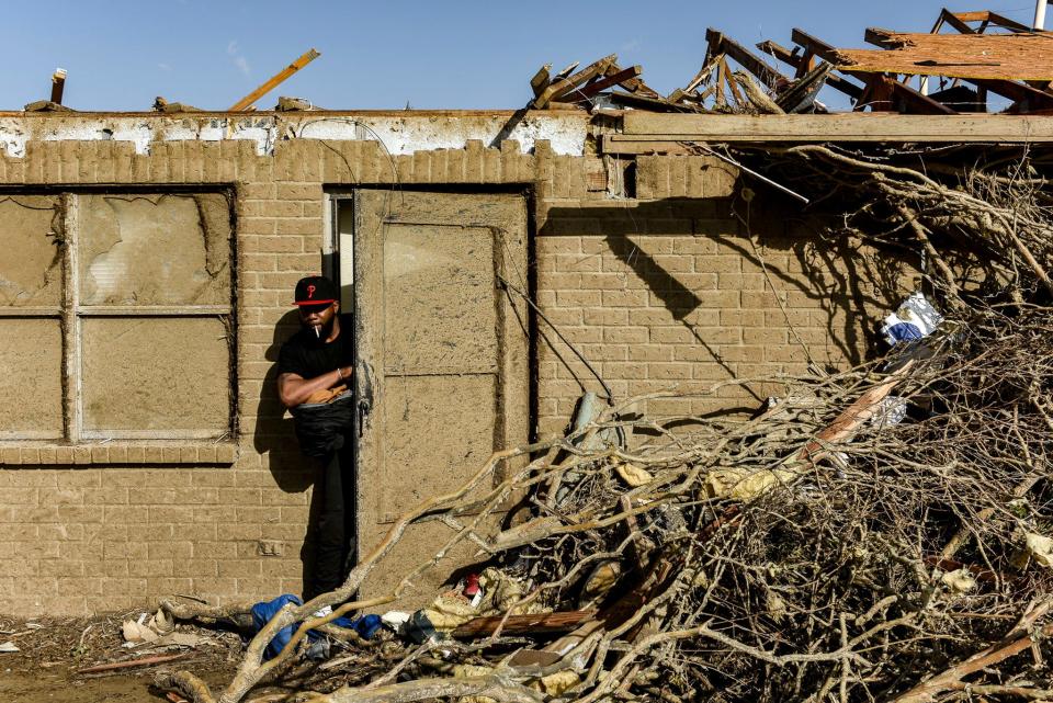 Terry York, a Silver City, Miss., resident exits what's left of his home on March after Friday's deadly tornado.