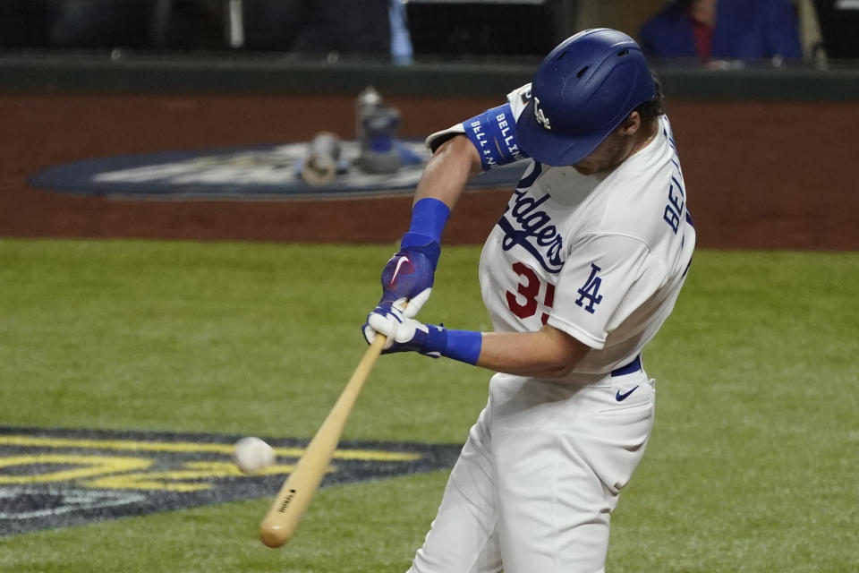 Los Angeles Dodgers' Cody Bellinger hits a two-run home run against the Tampa Bay Rays during the fourth inning in Game 1 of the baseball World Series Tuesday, Oct. 20, 2020, in Arlington, Texas. (AP Photo/Tony Gutierrez)