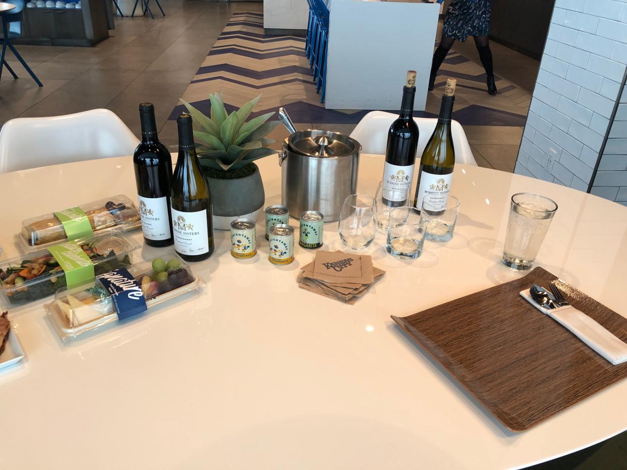 Main cabin meals (left) and new alcohol offerings on Alaska Airlines.