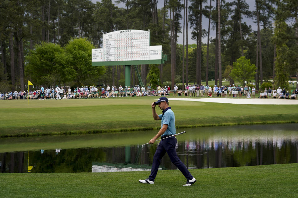 Justin Thomas acknowledges the gallery as he walks to the 15th green during the second round of the Masters golf tournament on Friday, April 9, 2021, in Augusta, Ga. (AP Photo/David J. Phillip)