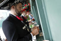 <p>Chris Stock of Chattanooga, Tenn., places bets before the 144th running of the Kentucky Derby horse race at Churchill Downs Saturday, May 5, 2018, in Louisville, Ky. (Photo: John Minchillo/AP) </p>