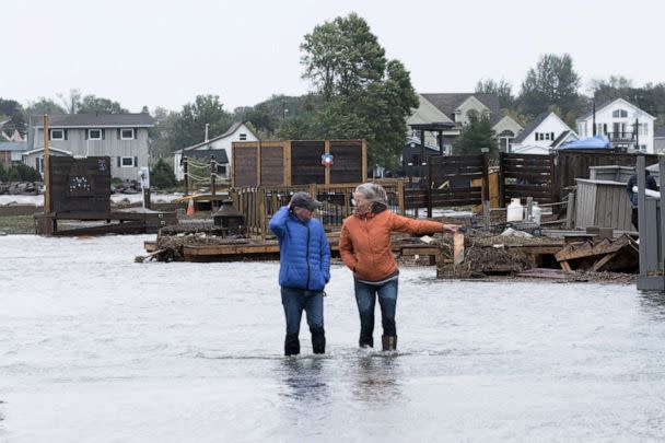 PHOTO: Residents stand in flood waters following the passing of Hurricane Fiona, later downgraded to a post-tropical cyclone, in Shediac, New Brunswick, Canada, on Sept. 24, 2022. (Greg Locke/Reuters)