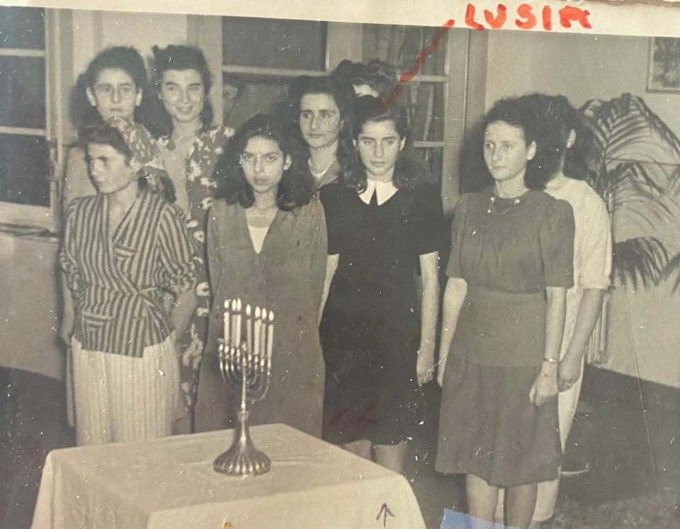 As a girl during the Holocaust, Lucy Lipiner (in the black dress with a white collar) stayed in an orphanage in Antwerp, Belgium. Courtesy of Lucy Lipiner