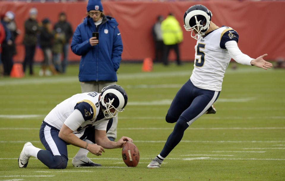 Los Angeles Rams kicker Sam Ficken (5) and holder Johnny Hekker warm up before Ficken's debut against the Titans. (AP)