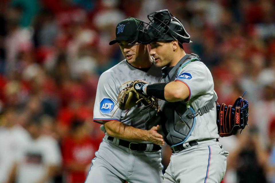 Aug 8, 2023; Cincinnati, Ohio, USA; Miami Marlins relief pitcher David Robertson (19) hugs catcher Nick Fortes (4) after the victory over the Cincinnati Reds at Great American Ball Park. Mandatory Credit: Katie Stratman-USA TODAY Sports