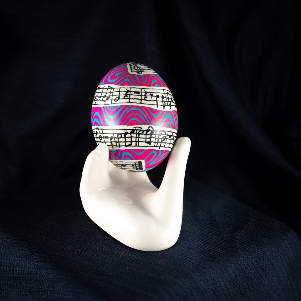 This egg was given as a gift to one of Reinder's friends for her 50th birthday. Reinders, who is also a musician, wrote the melody for If It Be Your Will by Leonard Cohen on the egg.