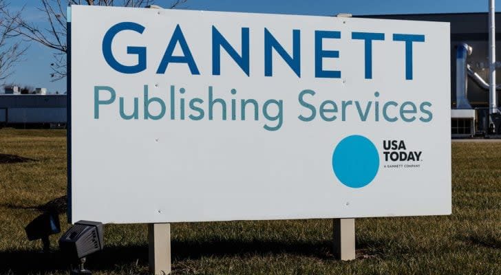 An outside view of a white board displaying the Gannett Publishing Services, LLC. logo