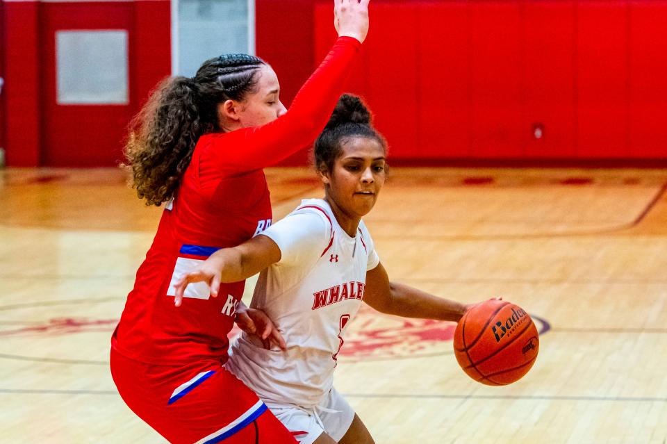 New Bedford's Vanessa Bucha powers her way to the basket.