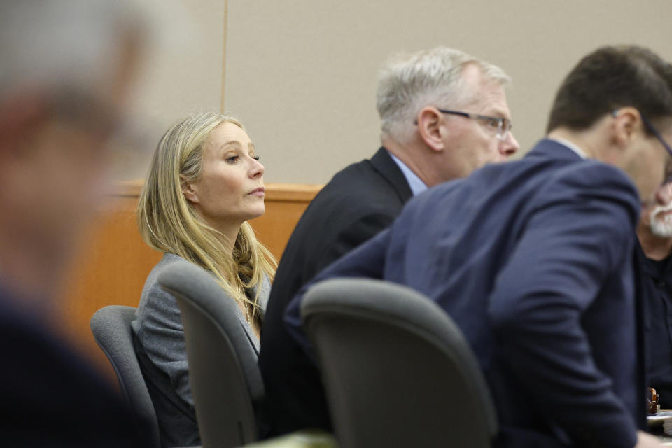 Gwyneth Paltrow sits in court during an objection in her trial, Thursday, March 23, 2023, in Park City, Utah, where she is accused in a lawsuit of crashing into a skier during a 2016 family ski vacation, leaving him with brain damage and four broken ribs. Terry Sanderson claims that the actor-turned-lifestyle influencer was cruising down the slopes so recklessly that they violently collided, leaving him on the ground as she and her entourage continued their descent down Deer Valley Resort, a skiers-only mountain known for its groomed runs, après-ski champagne yurts and posh clientele. (AP Photo/Jeff Swinger, Pool)