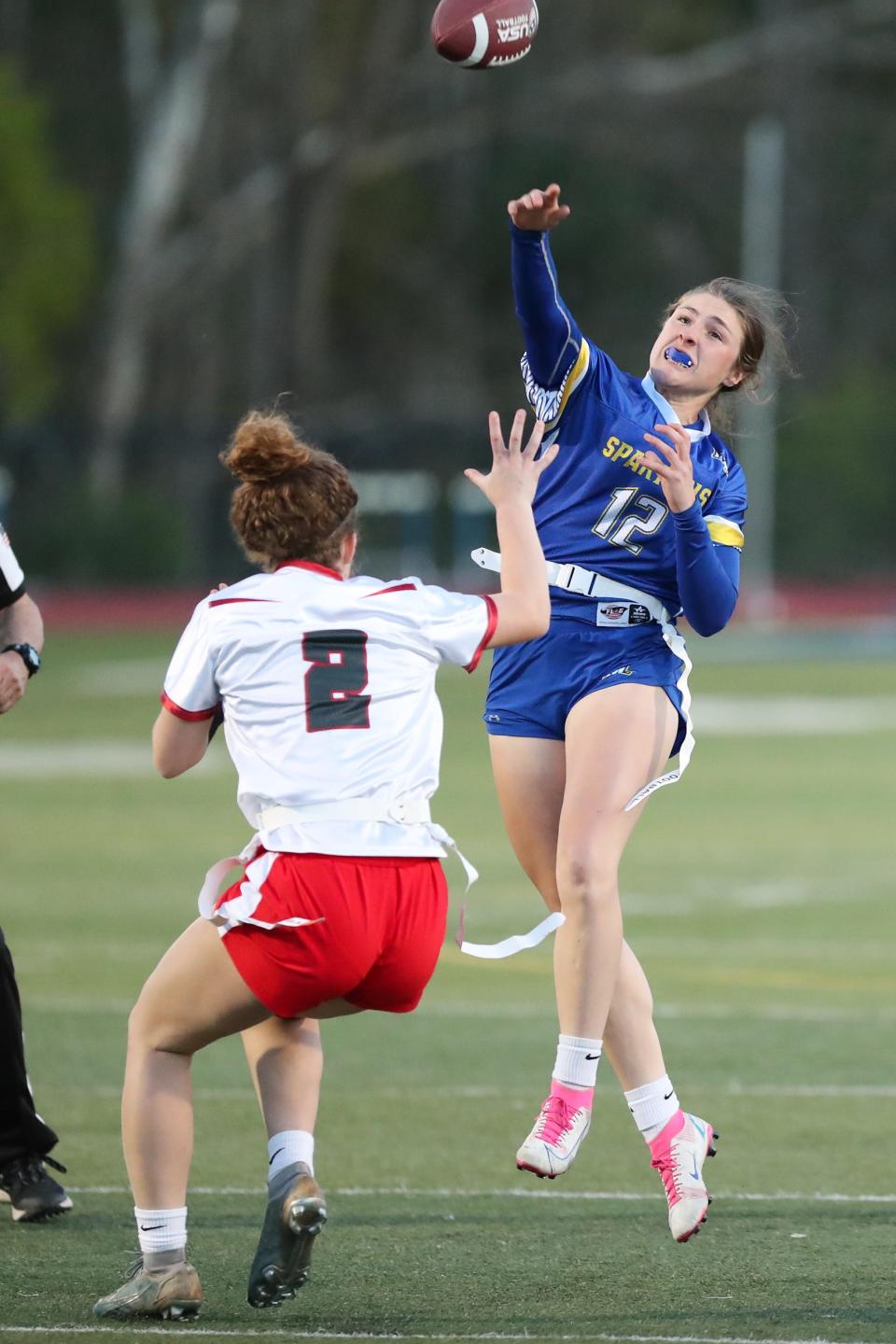 Maine-Endwell's Kaety L'Amoreaux gets the pass off as Chenango Valley's Nadia Wojcik closes in during a Section 4 flag football game Saturday, May 6, 2023. Host Maine-Endwell won 25-0.