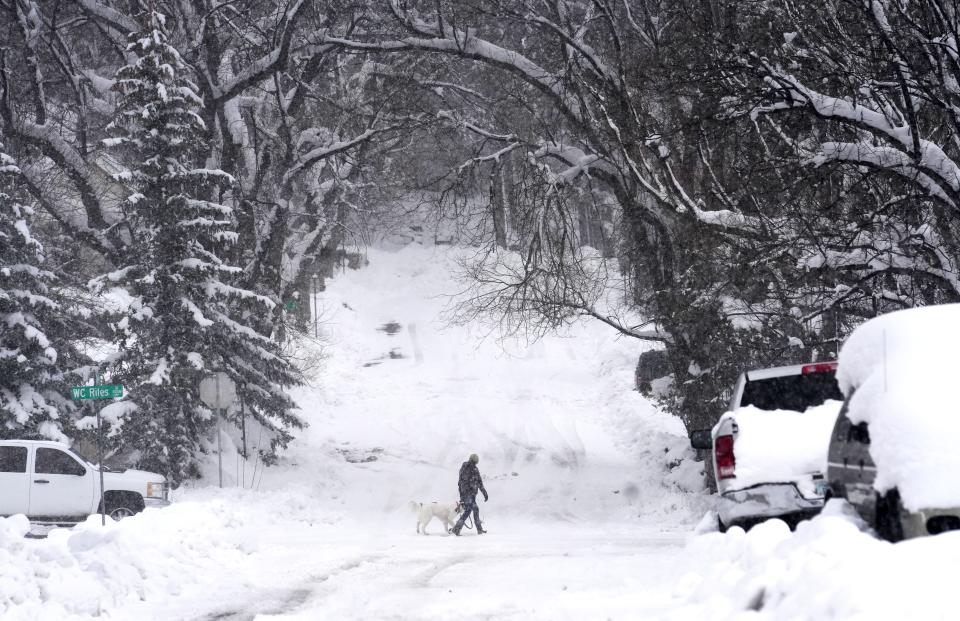 Heavy snowfall covers Downtown Flagstaff, Ariz., on Monday.