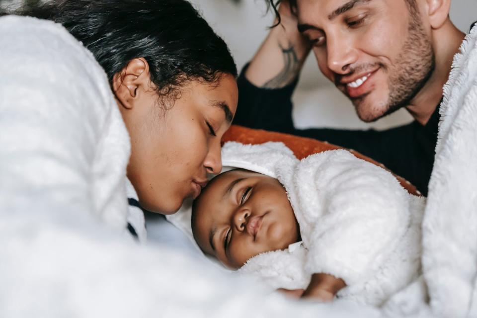 Nurses can remind new parents they’re doing a good job. <a href="https://www.pexels.com/photo/cheerful-young-multiethnic-parents-admiring-sleeping-baby-on-bed-6392952/" rel="nofollow noopener" target="_blank" data-ylk="slk:Pexels/William Fortunato;elm:context_link;itc:0;sec:content-canvas" class="link ">Pexels/William Fortunato</a>