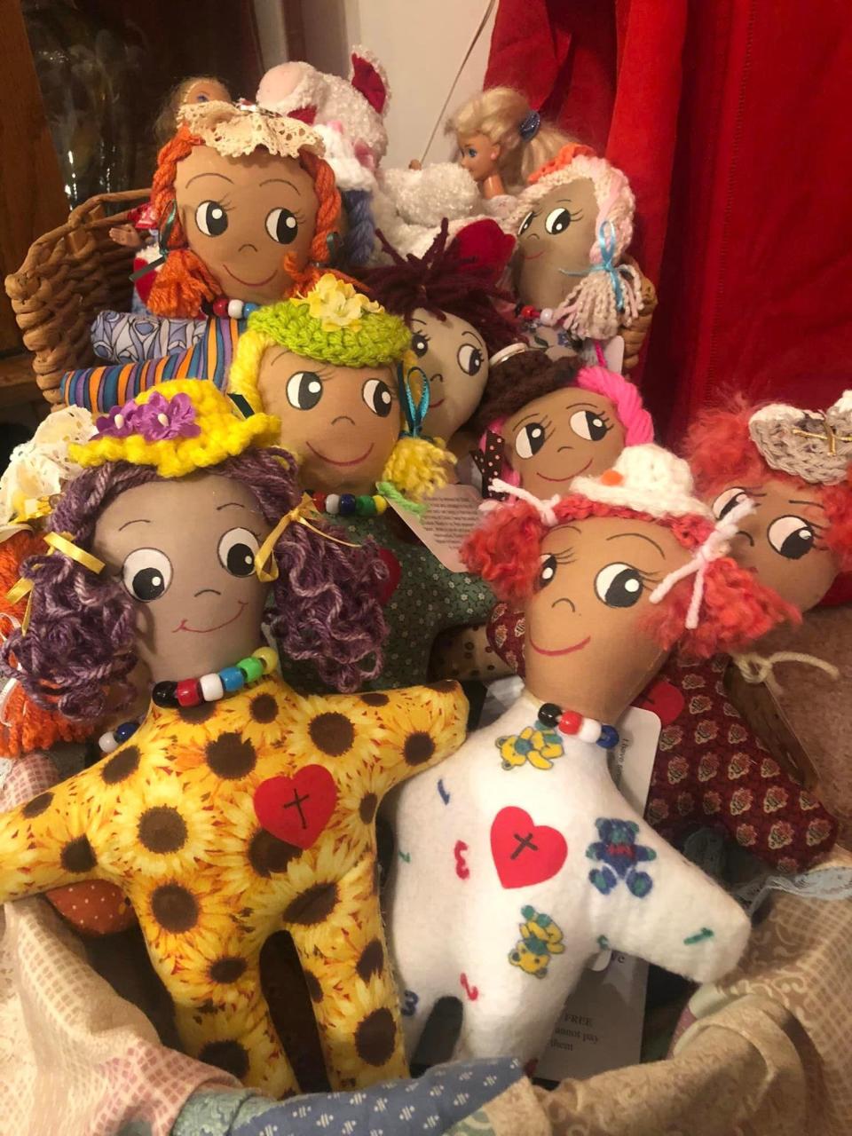 Centenarian Eva Mowen and other volunteers made these Dolls on a Mission dolls.