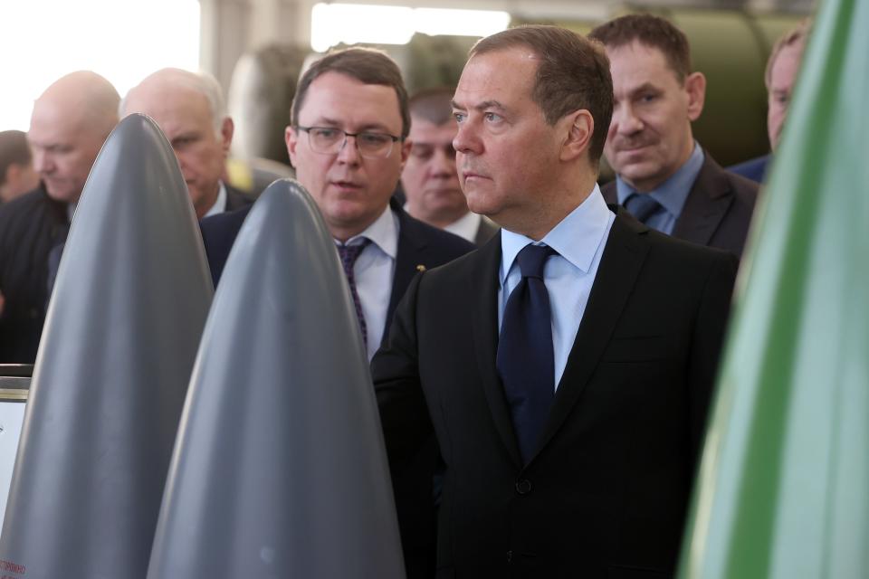 FILE - Deputy head of Russia's Security Council and chairman of the United Russia party Dmitry Medvedev, right, looks at productions while visiting Raduga Machine-Building Design Bureau in Dubna 116 km (73 miles) north of Moscow, Russia, Feb. 2, 2023. Medvedev, the deputy head of Russia's Security Council who served as a placeholder president in 2008-12 because Putin was term-limited, has unleashed near-daily threats that Moscow won't hesitate to use nuclear weapons. (Ekaterina Shtukina, Sputnik Pool Photo via AP, File)