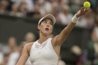 Jul 15, 2017; London, United Kingdom; Garbine Muguruza (ESP) in action during her final match against Venus Williams (USA) on day twelve at the All England Lawn Tennis and Croquet Club. Mandatory Credit: Susan Mullane-USA TODAY Sports