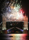 LONDON, ENGLAND - JULY 27: Fireworks light up Tower Bridge as the London 2012 Olympics opening ceremony takes place on July 27, 2012 in London, England. Athletes, heads of state and dignitaries from around the world have gathered in the Olympic Stadium for the opening ceremony of the 30th Olympiad. London plays host to the 2012 Olympic Games which will see 26 sports contested by 10,500 athletes over 17 days of competition. (Photo by Peter Macdiarmid/Getty Images)