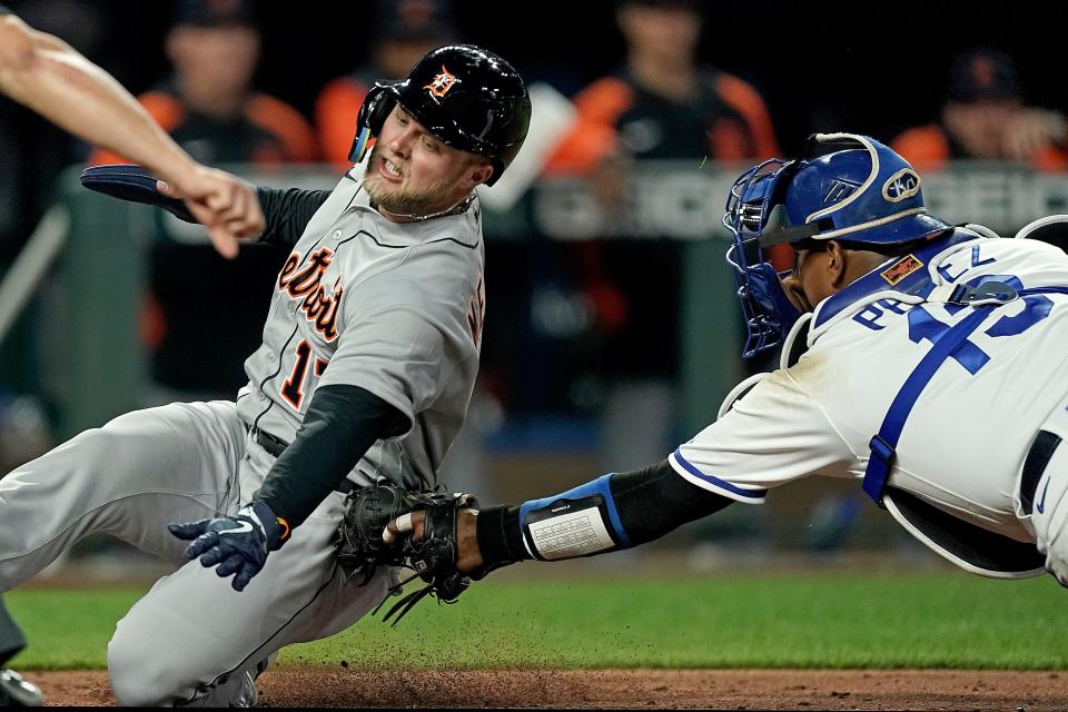 Detroit Tigers' Austin Meadows is tagged out at home by Kansas City Royals catcher Salvador Perez as he tried to score on a single by =Miguel Cabrera during the sixth  inning on Thursday, April 14, 2022, at Kauffman Stadium in Kansas City, Missouri.