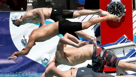 Apr 17, 2015; Mesa, AZ, USA; Michael Phelps dives off the block in the Men's 400 meter freestyle prelims during the 2015 Arena Pro Swim Series at the Skyline Aquatic Center. Phelps finished 17th, with a time of 4:02.67 in the Men's 400 meter freestyle prelims. Mandatory Credit: Rob Schumacher/Arizona Republic via USA TODAY Sports