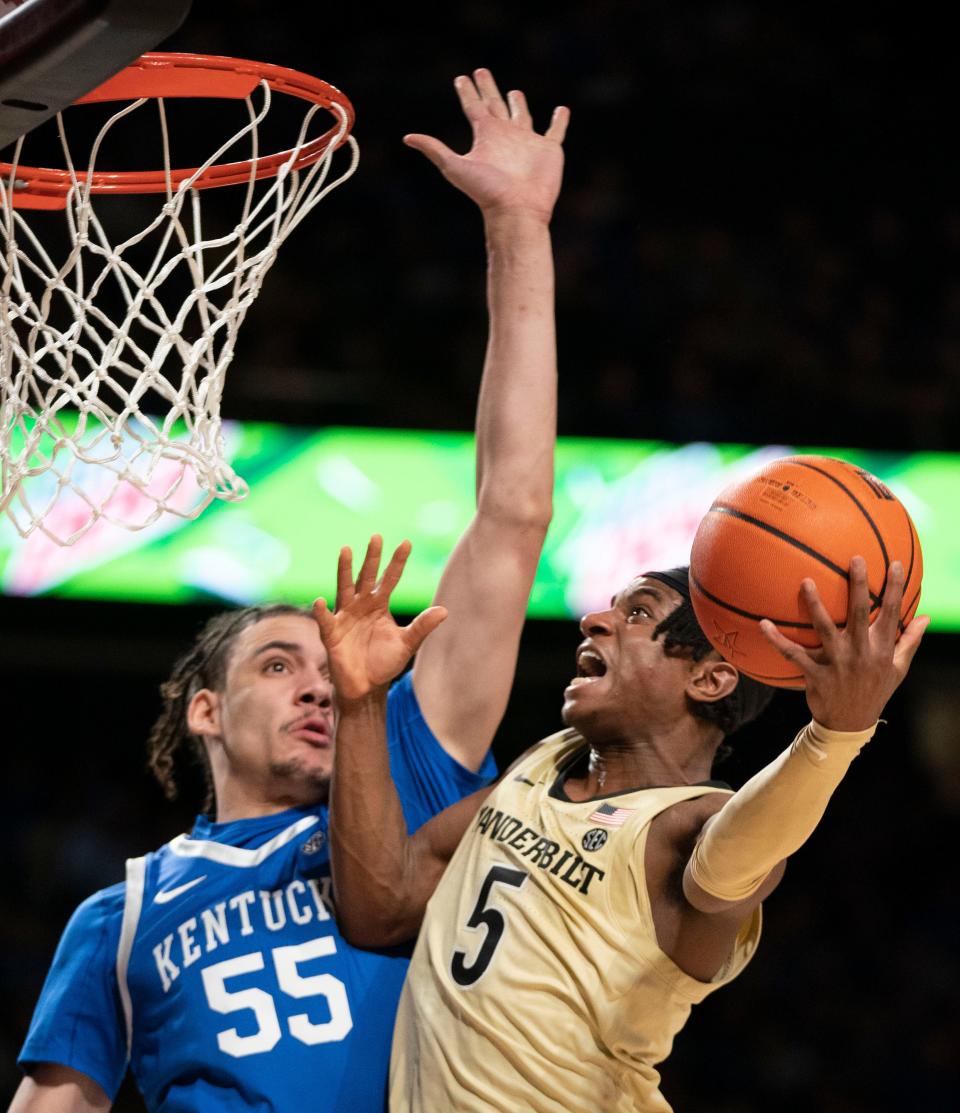 Vanderbilt guard Ezra Manjon (5) shoots past Kentucky forward Lance Ware (55) during the second half at Memorial Gymnasium Tuesday, Jan. 24, 2023, in Nashville, Tenn. 