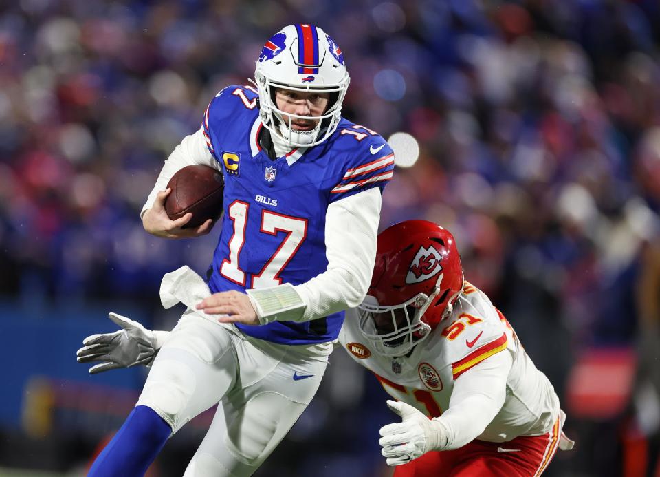 Josh Allen #17 of the Buffalo Bills runs against Mike Danna #51 of the Kansas City Chiefs during their AFC Divisional Playoff game at Highmark Stadium on January 21, 2024 in Orchard Park, New York.